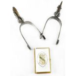 A pair of white metal officer's spurs and a book of 'Common Prayer and Administration of the