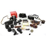 Various vintage cameras, lenses and equipment to include a Praktica MTL3, a Yashica TL Electro X,