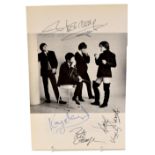 THE KINKS; a page from a book with photographic image to the centre and bearing signatures around.