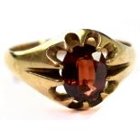 A gentlemen's vintage hallmarked 9ct gold signet ring with claw set garnet, size U, approx 4g.