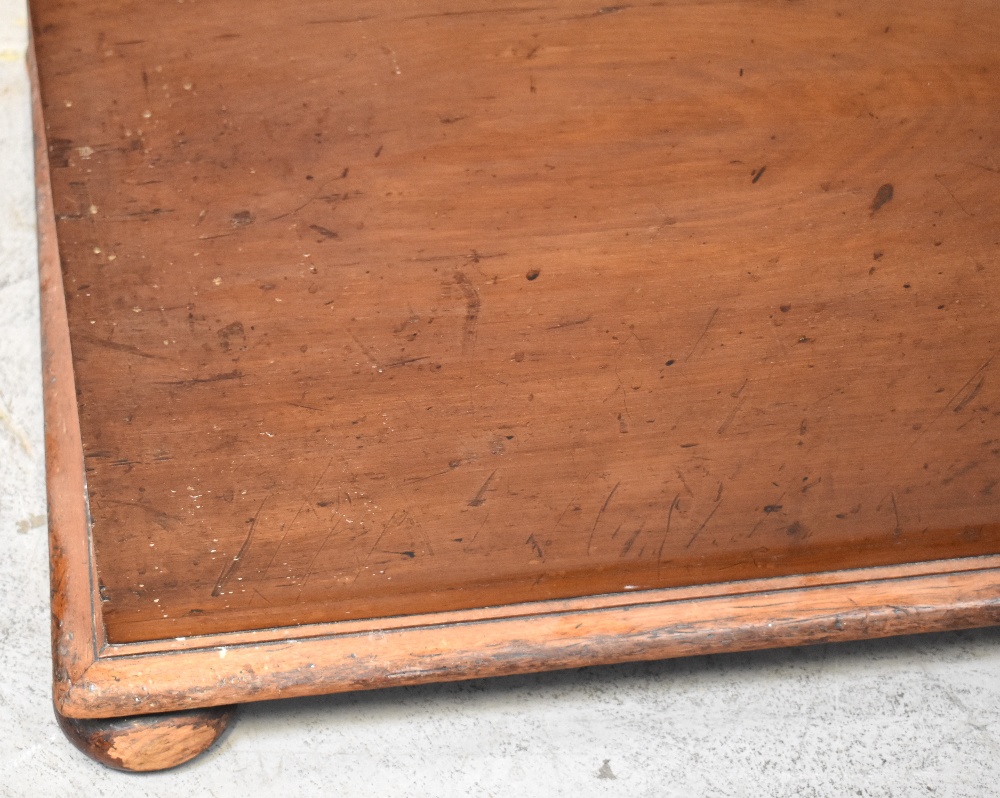 A mahogany ottoman with upholstered padded seat lid, raised on squat bun feet, 57 x 105 x 54cm. - Image 2 of 3