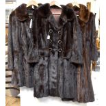 Three vintage c1960s mink coats comprising a brown three-quarter length mid coat with Peter Pan