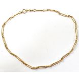A gold watch chain/necklace,