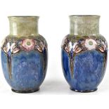 ROYAL DOULTON; a pair of early 20th century baluster vases,