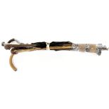 Three vintage walking sticks to include two with bent crook handles embellished with brass and