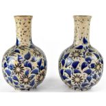 ROYAL DOULTON; a pair of late 19th/early 20th century baluster vases,