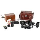 Various cameras and equipment to include a Nikon Model FM2 35mm SLR camera, one other Nikon camera,