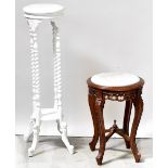 A reproduction carved jardinière stand with inset white marble top,