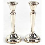 A pair of modern weighted hallmarked silver short candlesticks, Birmingham 1990.