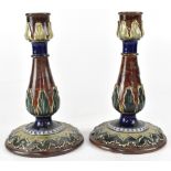 ROYAL DOULTON; a pair of Royal Doulton Secessionist candlesticks,