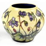 MOORCROFT; a squat baluster vase, yellow ground with tube lined 'Hepatica' pattern decoration,