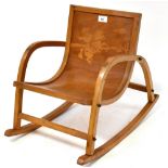 A child's bentwood rocking chair with cowboy design to the seat back, height 43cm.