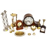 An H Samuel Napoleon hat style mantel clock with silvered dial and chiming movement,