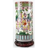 A Chinese cylindrical vase/stick stand in the Famille Rose palette,