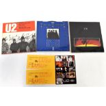 U2; three records to include 'Fire', signed on rear,