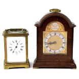 An early 20th century French brass carriage clock, the white dial set with Roman numerals,