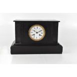 A black slate chiming mantel clock, the white enamelled dial set with Roman numerals,