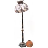 An early 20th century Japanese black lacquer standard lamp,