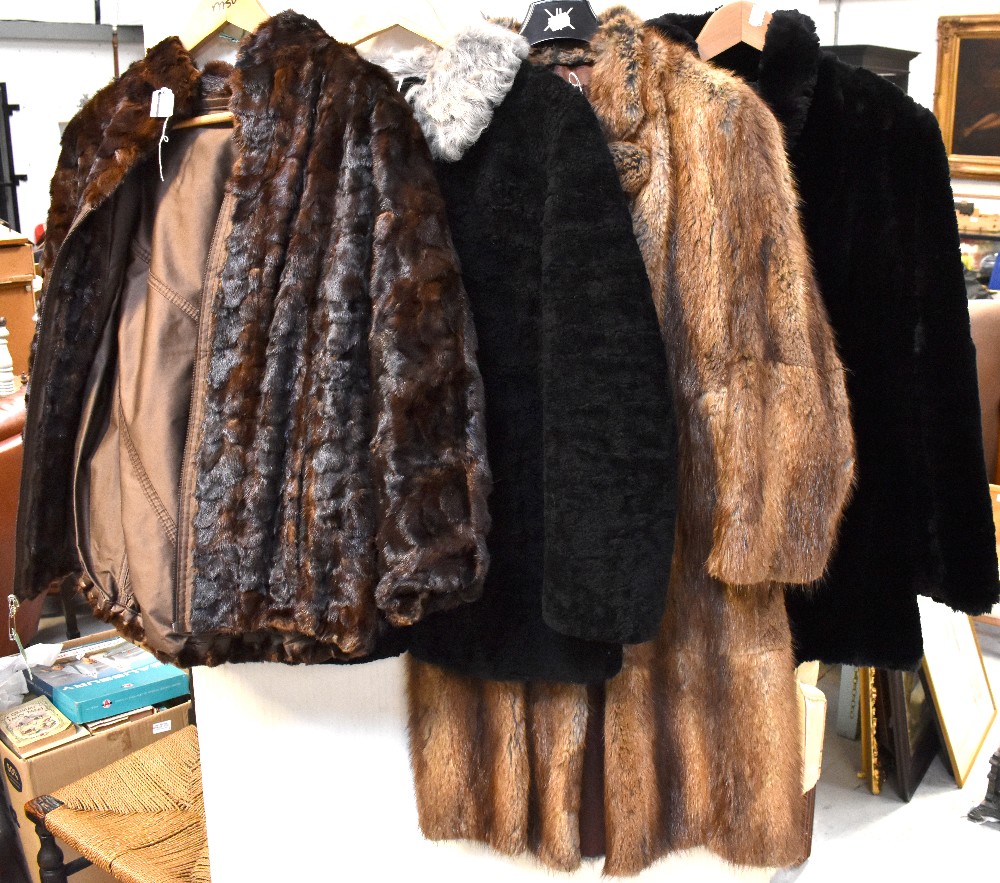 Four c1940s fur coats, a black three-quarter length coat with stand-up collar,
