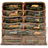 A late 19th/early 20th century Indian inspired waterfall paper rack of four rows of two