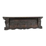 A late 19th/early 20th century Continental carved and stained oak coat rack, with two mask head