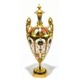 ROYAL CROWN DERBY; a large and impressive twin handled pedestal urn, decorated in the 1128