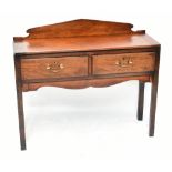 A late Georgian mahogany side table with raised back above two drawers above two drawers and