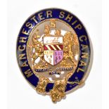 MANCHESTER SHIP CANAL INTEREST; a gilt metal and enamelled badge decorated to the centre with the