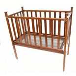Maples & Co; an Edwardian line inlaid mahogany cot with slatted decoration, raised on late