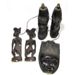 A pair of West African carved hardwood table lamps modelled as a male and female bust, height