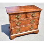 A good reproduction burr walnut chest of two short over two long drawers on bracket feet, height