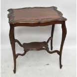 A Victorian walnut occasional table of shaped outline on knee carved stretchered cabriole supports