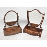 Two 19th century mahogany toilet mirrors including a Hepplewhite-style example with shield shaped