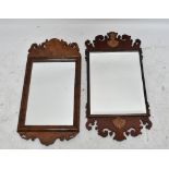 Two reproduction Georgian style fretwork wall mirrors including a mahogany example with applied open