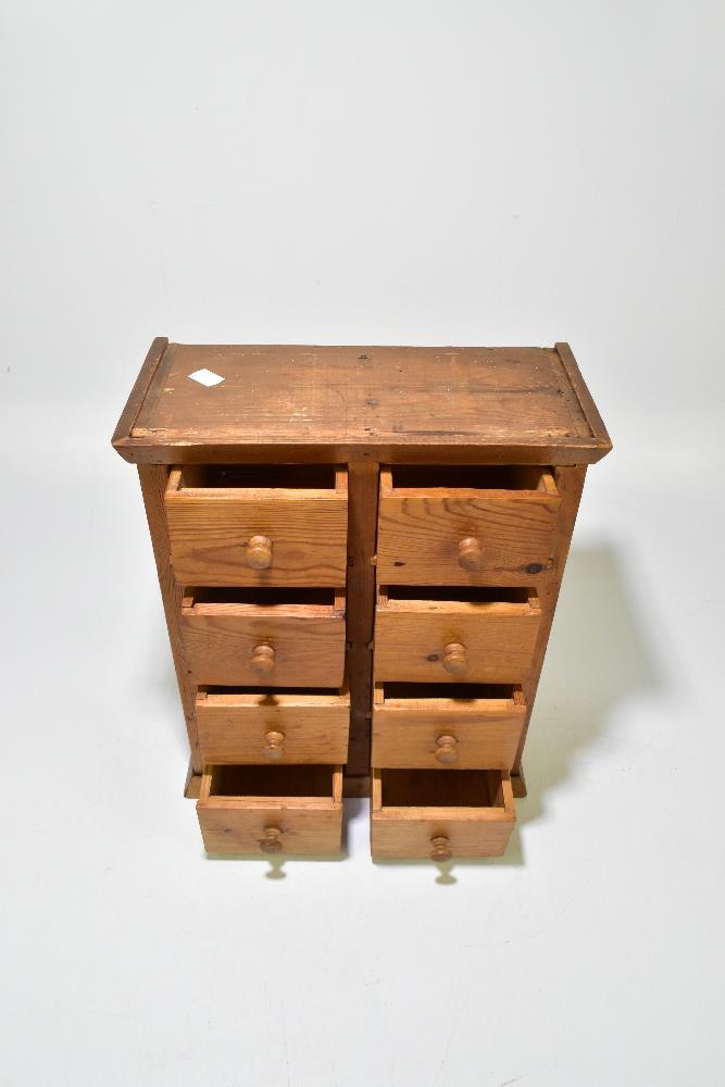 A pine miniature chest of eight drawers, raised on plinth base, width 33.5cm, height 40.5cm, depth - Bild 3 aus 6