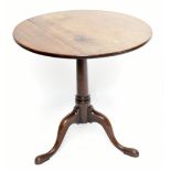 A Georgian mahogany circular tilt top tripod table, diameter 68cm, height 72cm.Additional