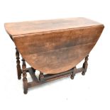 TITCHMARSH & GOODWIN; an oak drop leaf gateleg dining table on turned and block stretchered