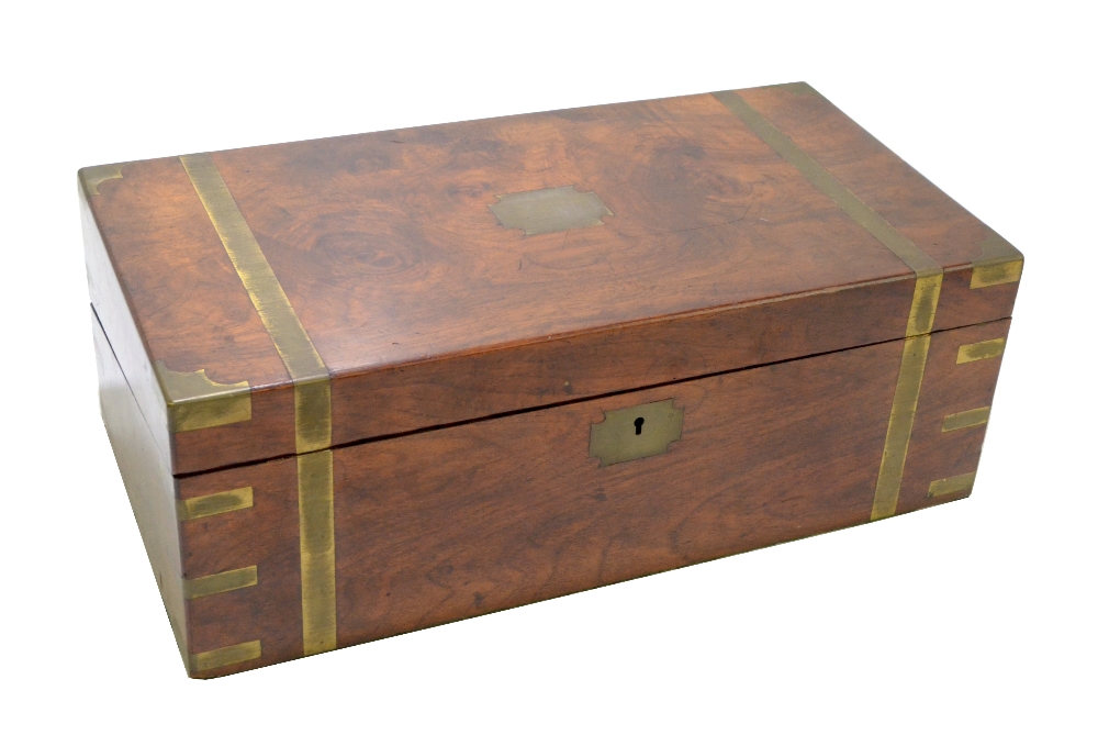 A 19th century brass bound walnut writing slope, the hinged cover enclosing black leather slope