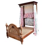 A 19th century carved mahogany single half tester bed, with moulded cornice canopy above cushioned