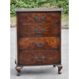 A 1950s walnut bowfronted chest of four drawers, raised on cabriole supports width 50cm, depth 37cm,