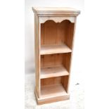 A modern pine freestanding bookcase, with four fixed shelves on plinth base, height 178cm, width