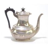 GEORGE UNITE; a Victorian hallmarked silver teapot with gadrooned detail, Birmingham 1897, height