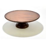 A late Victorian mahogany circular Lazy Susan with dished top, on circular base, height 18cm,