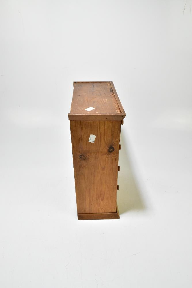 A pine miniature chest of eight drawers, raised on plinth base, width 33.5cm, height 40.5cm, depth - Bild 4 aus 6