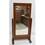 An early 20th century oak framed cheval mirror with bevelled plate, height 155cm.