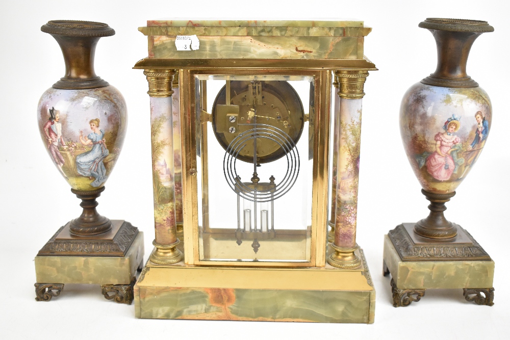 MARTI ET CIE; a late 19th century French onyx, gilt metal and porcelain mantel clock garniture, - Image 9 of 12