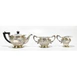 WAKELY & WHEELER; a Victorian hallmarked silver three piece tea service with bright cut and repousse