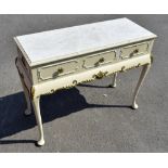 A French-style white painted dressing table, with formica top above three short drawers and a shaped