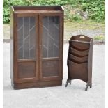 An early 20th century oak bookcase, the pair of leaded glazed doors enclosing two adjustable