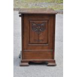 An early 20th century carved oak coal purdonium, with hinged cover and carved Art Nouveau decoration